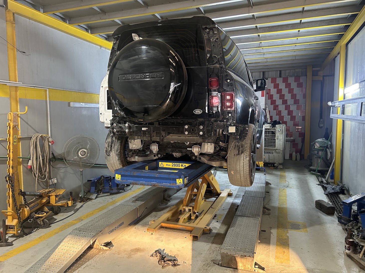 Fully restored vehicle frame and chassis ready for assembly at Drive Zone Auto
